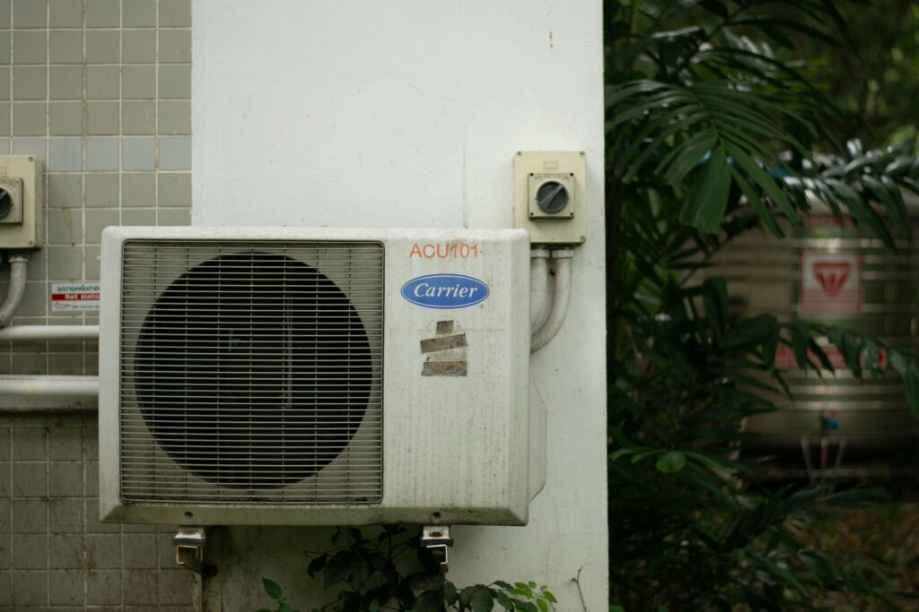 A decaying HVAC system sits outside.